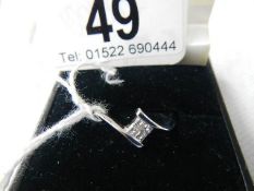 An 18ct white gold 4 stone diamond ring, good clarity, size M.