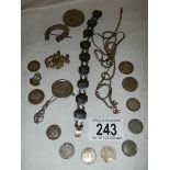 A mixed lot including silver bracelets, silver coins etc., 45 grams.