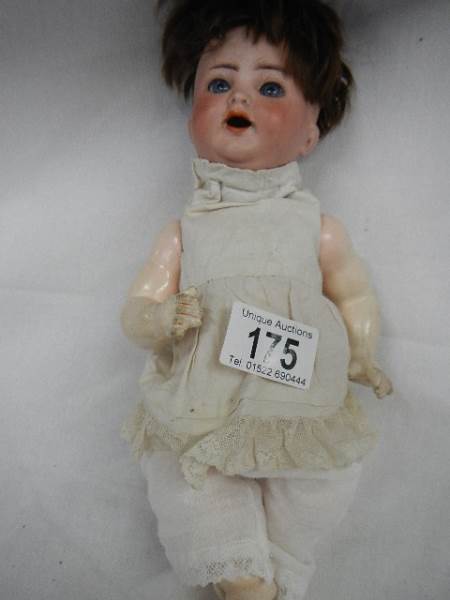 A small early 20th century German bisque headed doll by Kammer and Reinhardt with moveable arms, - Image 3 of 5