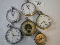 3 pocket watches, 2 stop watches and a compass.