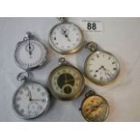 3 pocket watches, 2 stop watches and a compass.