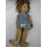 An early 20th century Chad Valley 'Bambina' doll with glass eyes and original button on right side