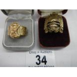 2 unusual brass rings, one depicting an Egyptian Pharoah.