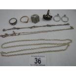 A mixed lot of silver including 3 silver chains, 6 silver rings etc.
