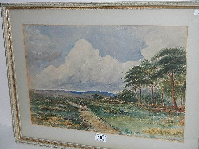 A framed and glazed watercolour rural scene with figures walking up a farm track, signed P Martin,
