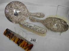 A Four piece silver dressing table set.