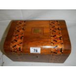A Victorian mahogany inlaid sewing box in good condition.