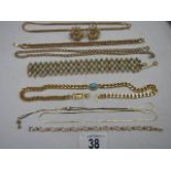 A mixed lot of gold coloured pendants (8 items).