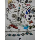 A mixed lot of costume jewellery including earrings, rings etc., some silver.