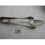 A silver spoon and silver sugar nips. ****Condition report**** Weight approx.