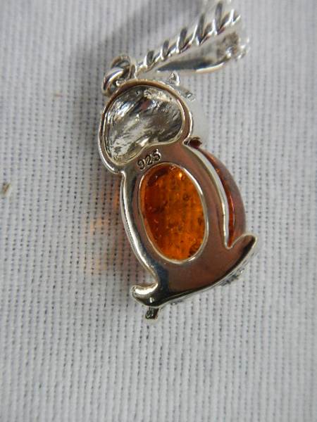 A silver owl set with amber coloured stone on a silver chain, marked 925. - Image 3 of 3