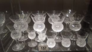 A collection of 14 thistle pattern cut glass wine glasses and other glasses, all in good condition.