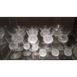 A collection of 14 thistle pattern cut glass wine glasses and other glasses, all in good condition.