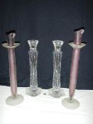 A pair of lead crystal candlesticks (30cm) and another pair of glass candlesticks.