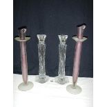 A pair of lead crystal candlesticks (30cm) and another pair of glass candlesticks.