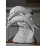 A large white ceramic dolphin group 49 cm tall a/f base has a number of hairline cracks.