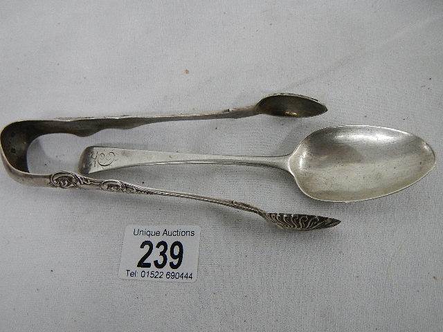 A silver spoon and silver sugar nips. ****Condition report**** Weight approx. - Image 2 of 4