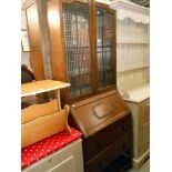 A 1930's oak bureau bookcase, 2 drawers with key, height 190cm, width 75cm approx.