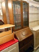 A 1930's oak bureau bookcase, 2 drawers with key, height 190cm, width 75cm approx.
