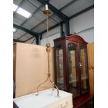 A vintage wrought iron candlestick converted to a floor standing lamp, will need re-wiring,