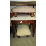 Three cream fabric covered stools.