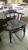 A Victorian monogrammed captain's chair.