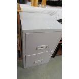 A two drawer filing cabinet, 65.5 cm high, 40 cm wide (no key).