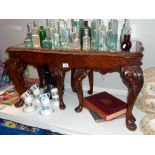 A carved darkwood stained glass top long nest of tables