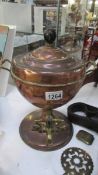 A copper samovar urn.