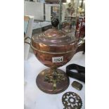 A copper samovar urn.