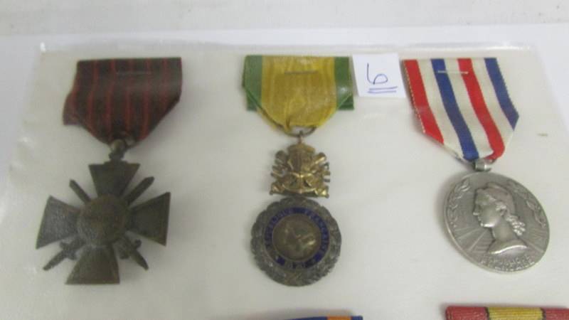 A board of 8 foreign medals. - Image 2 of 4