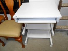 A small grey computer desk