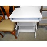 A small grey computer desk