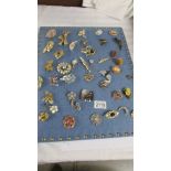 Approximately 40 vintage and mid 20th century brooches in various designs including a mermaid.