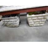 A pair of cement garden planters