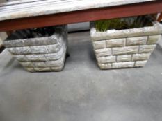 A pair of cement garden planters