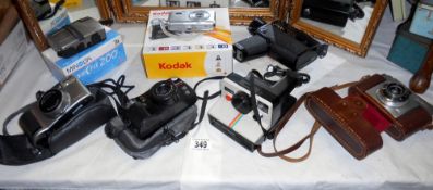 A quantity of various cameras including Kodak, Minolta 200, Ilford Sportsman, Polaroid, Olympus 110,