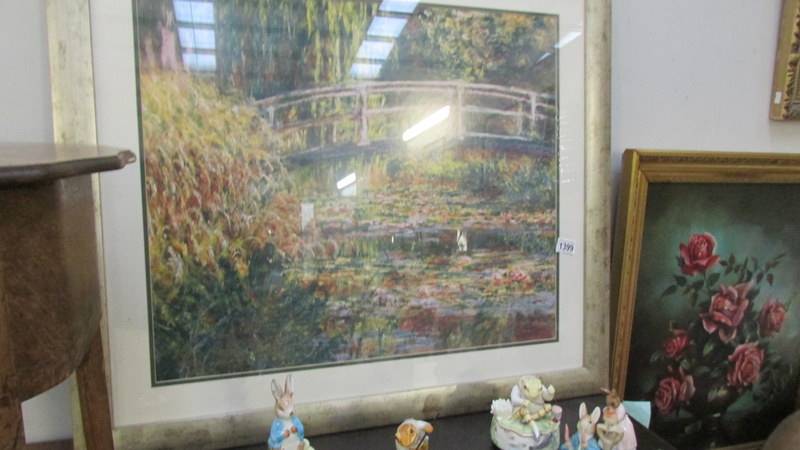 A framed and glazed vibrant print of Monet's 'Bridge at Giverny' (88 x 78 cm).