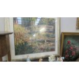 A framed and glazed vibrant print of Monet's 'Bridge at Giverny' (88 x 78 cm).