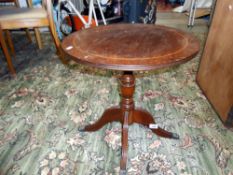 A round oak table with claw feet