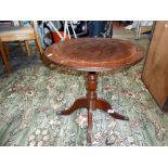 A round oak table with claw feet