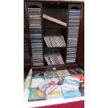 A large quantity of music CD's including Alfie Bo, Kathryn Jenkins, Kiri together with CD cabinet,