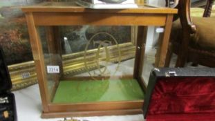 A glazed shop cabinet with Cartier lettering.