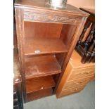 An oak bookcase, height 127cm, width 49.5cm approx.