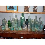 A quantity of antique glass bottles