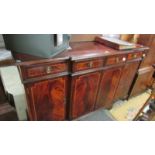 A mahogany string inlaid break front sideboard in clean condition.