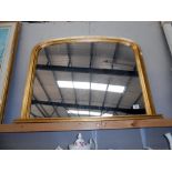 An antiqued finished gilt framed overmantle mirror size;