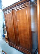 A large darkwood stained 2 door wardrobe with adjustable shelves, height 212cm, width 170cm,