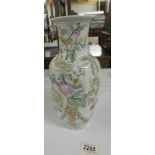 A Chinese vase with coloured prunus flowers, 32 cm tall.