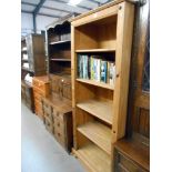 A solid pine 5 shelf book case, Height 183.5cm, width 77cm approx.